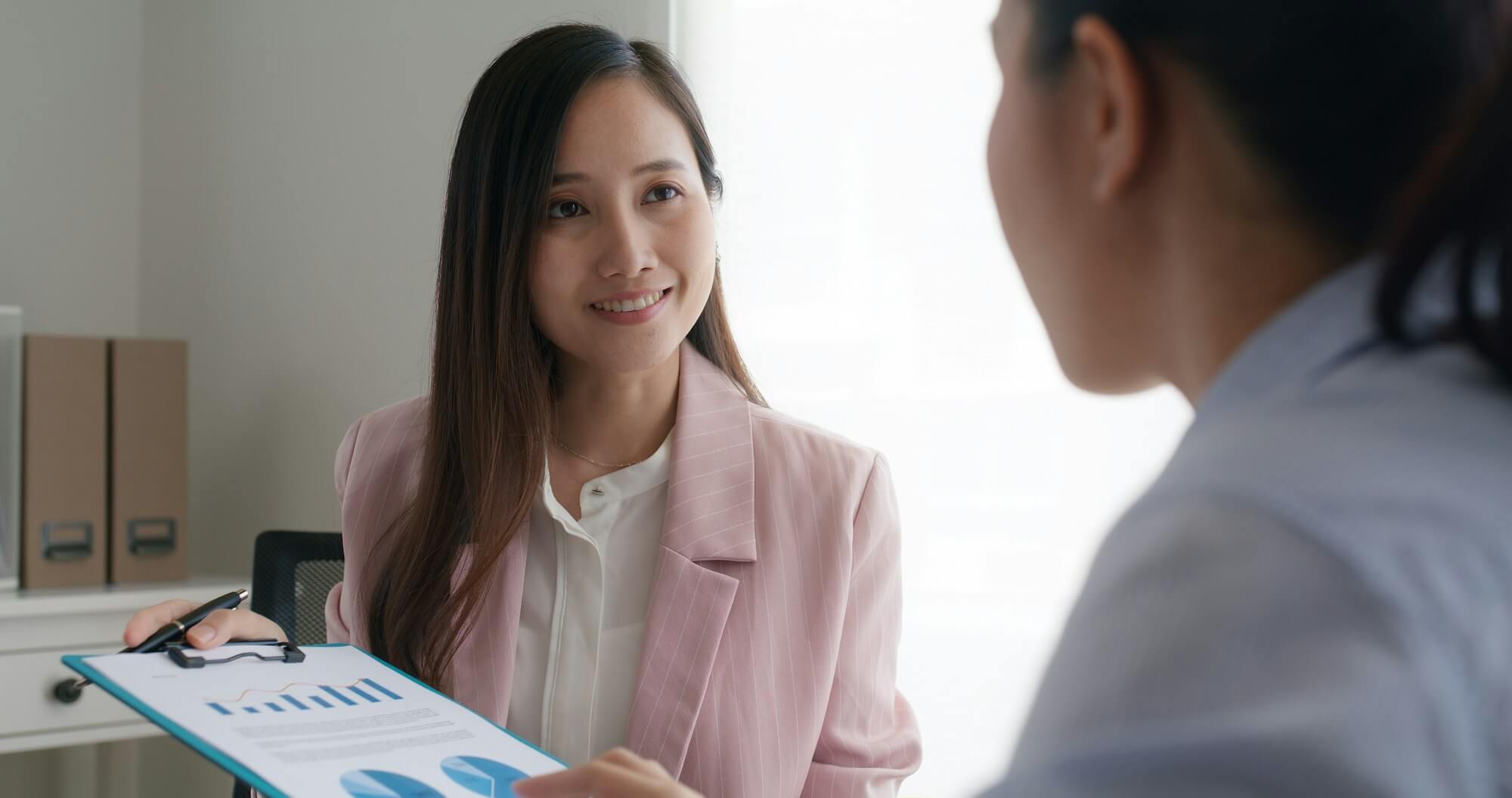 Asia woman real estate sale agent or trader advice sitting at lawyer office desk.jpg